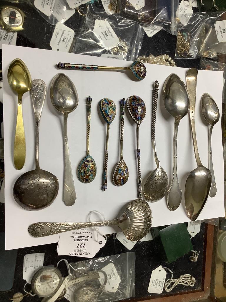 A late 19th century Russian 84 zolotnik tea strainer, a Russian cake slice and sugar sifter and a group of other Russian flatware including enamelled teaspoons